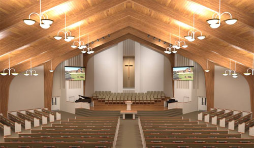  Uma igreja moderna e iluminada, com teto alto e inclinado de madeira clara. Lustres pendentes com múltiplas cúpulas brancas alinham-se nas laterais. O altar tem uma cruz simples ao centro e está elevado. Telas de projeção flanqueiam o altar. Assentos de madeira clara organizam-se em fileiras