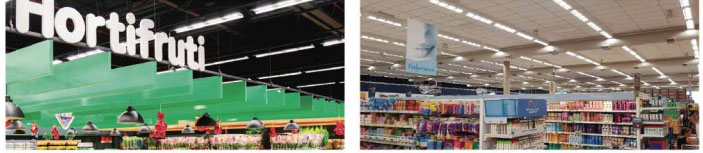 mostra o teto de om hortifruti e um supermercado bem iluminado