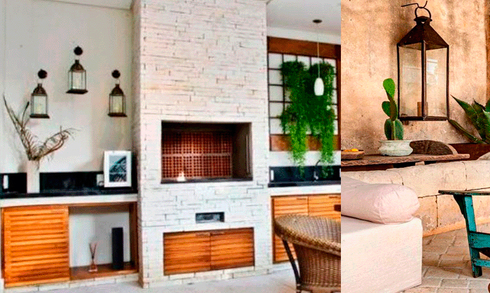 A imagem mostra duas áreas distintas de decoração. À esquerda, uma churrasqueira moderna de tijolos claros com armários de madeira e três lanternas decorativas escuras fixadas na parede branca. À direita, um ambiente externo rústico com um cacto em um vaso sobre uma mesa de pedra, uma grande lanterna pendurada, e parte de um sofá claro